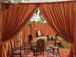 Velvet Spice Drape used in a tent perimeter